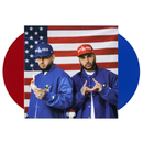 Two individuals wearing blue jackets and hats with visible branding in front of an American flag.