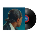 Vinyl record with a cover featuring a person's profile against a blue background