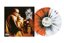 Half orange and white with black splatter Vinyl record with a colorful sleeve and a person in a hooded outfit.