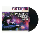 Vinyl record with colorful cover featuring a person holding a microphone and fireworks, titled 'Rejoice! Rappers Are Rapping Again!'.