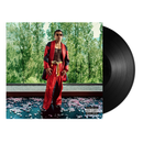 Vinyl record with a Lyrics Born in a red outfit on the cover, set against trees 