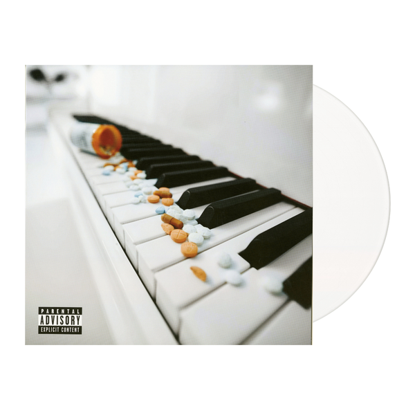 Vinyl record with a cover featuring a piano keyboard and colorful pills, labeled 'Parental Advisory'.