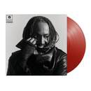 Vinyl record with a black and white portrait of Thundercat on the cover and a red vinyl disc.