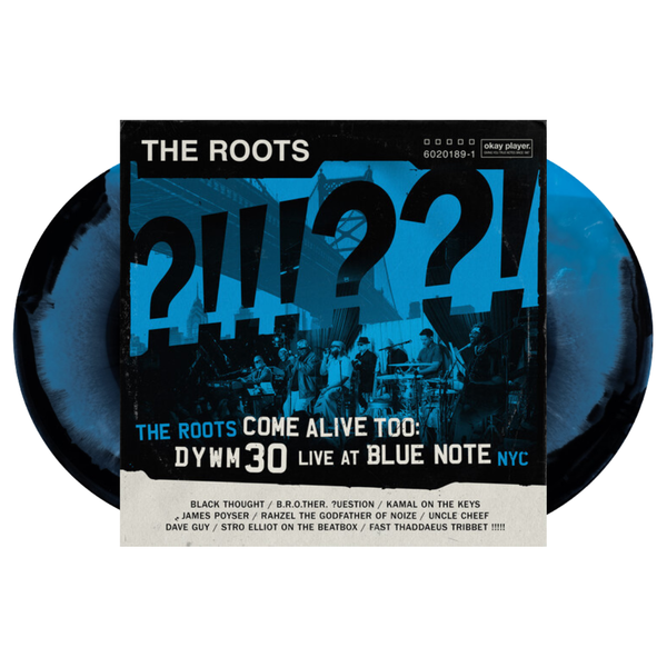 Vinyl record with 'The Roots' live album cover featuring question marks and event details of the band live at blue note NYC