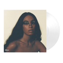 Vinyl record with a cover featuring Solanges face on a beige background