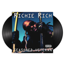 Vinyl record with 'Richie Rich' album cover featuring Richie Rich holding the bars of an iron gate
